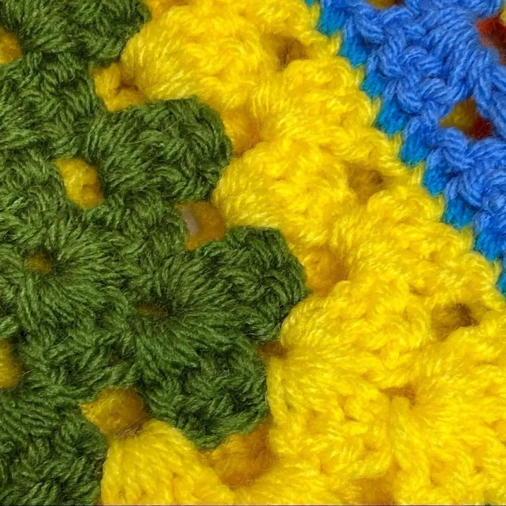 Hand crocheted bright multi colored Afghan size 56” X 31”